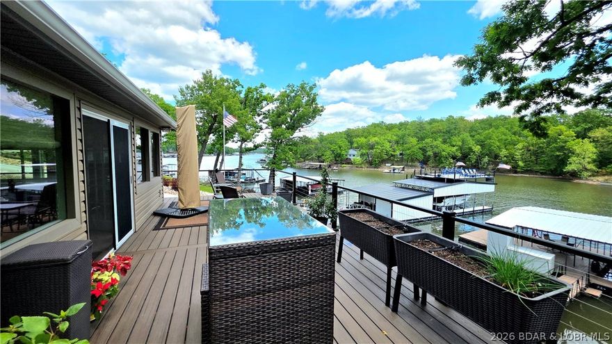 Sunlight pours through a wall of windows, turning the lake into living art in this beautifully remodeled waterfront retreat. Every glance feels like a postcard—wide-open views, shimmering water, & that unmistakable sense of calm you only get at the lake. Step outside & choose your vibe: morning coffee on one deck, afternoon lounging on another, & sunset cocktails on the third. Three distinct outdoor spaces create a layered experience of relaxation & entertaining, all leading to your private dock—your front-row seat to lake life. A second slip could be converted on the dock if needed. Detached two-car garage comes with an adorable, fully equipped 728 sq ft apartment, complete with kitchen, living area, washer/dryer, 2 sleeping areas & a full bath, ideal for guests, rental income, or a retreat of its own. Even better, the apartment comes fully furnished.  Updates throughout mean less to-do and more time to enjoy. And with a prime location near Sunrise Beach, you’re just minutes from shopping, dining, and all the lakefront fun you could want. This isn’t just a home—it’s your lake chapter Lifestyle, already in motion. This one checks all the boxes!