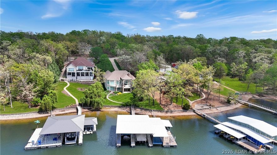 The finest home to come on the market in six mile cove with five comfortable bedrooms all ensuite plus an additional half bath for guests.  Very appealing roadside architecture and a gorgeous walk out on a gentle lot to enjoy the fantastic large cruiser dock.  Many updates over the years to include new kitchen with granite counters and new appliances.  The lower level was completely remodeled recently with class and style.  Popular extras include the covered upper level deck with remote screens, an extra large family room with custom wet bar and billiards room.  Bring the family and enjoy the Lake's most popular cove.