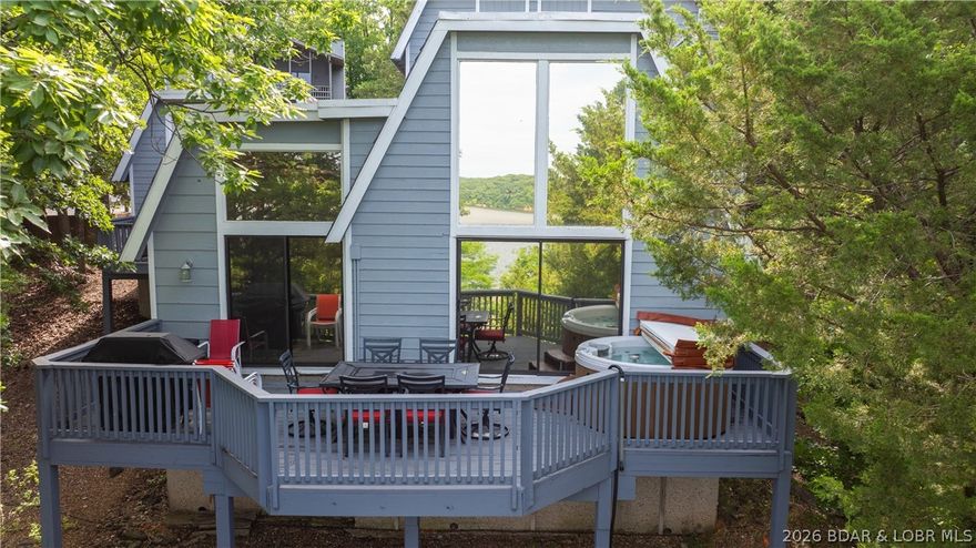 Located in the sought-after golf cart community of Tan Tar A Estates, this fully furnished 3-bedroom, 3-bath lakeview home offers the perfect blend of comfort, privacy, and income potential. Each spacious bedroom is designed as a private suite with its own full bathroom, and two feature private decks—ideal for hosting guests or creating relaxing personal retreats. Take in beautiful lake views from the main deck, complete with a hot tub overlooking the 26 MM—perfect for unwinding while boats pass by. Inside, you’ll find a cozy wood-burning fireplace, spacious rooms, nice dining area, and a new refrigerator (June 2025).  Add in ample parking and this makes the home well-suited for year-round enjoyment. Located in Osage Beach next to Margaritaville Lake Resort Lake of the Ozarks, you’ll enjoy convenient access to restaurants, boat rentals, an indoor waterpark, spa, and more. Community amenities include pools and a golf course, all in the heart of Lake of the Ozarks. Whether you're looking for a personal getaway or a year-round vacation rental, this property delivers the ultimate lake lifestyle.