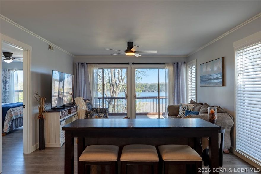 Indulge in breathtaking waterfront views from this beautifully appointed 2-bedroom, 2-bath condo featuring an open-concept living area and kitchen, perfect for entertaining. Both bedrooms offer comfortable accommodations, and the screened-in balcony with storage is ideal for relaxing, sunset watching, or enjoying lake activity. This unit is being sold turnkey and fully furnished, making it completely move-in ready for summer.
Located at the 22 MM in the heart of Osage Beach, you’ll love the convenience to popular restaurants and entertainment by land or water. The community offers great amenities including a swimming pool, basketball court, and playground. A brand new community concrete dock adds to the appeal, along with your own 12x32 boat slip for easy access to the water.
Whether you're looking for a personal getaway or rental investment, this condo offers the perfect blend of relaxation and convenience for lake life.