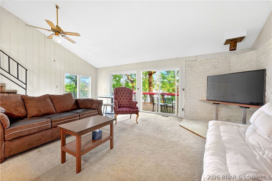 Tucked away on 2.33 lakefront acres, 33400 Kings Way Road offers the space, privacy, and lake lifestyle you’ve been waiting for. This 2-bedroom, 2.5-bath home features 1,654 sq ft, a walkout lower level, huge wraparound deck, screened porch, and beautiful sunset views over the water. The dock includes a boat hoist, electric, and rooftop entertaining deck, while the detached 2-car garage/shop offers room for boats, lake toys, and storage. With 265 ft of waterfront, private well, septic, metal roof, no HOA, and rentals allowed, this Stover retreat is ideal for full-time living, weekend escapes, or investment potential near restaurants, bars, International Raceway, and Laurie shopping.