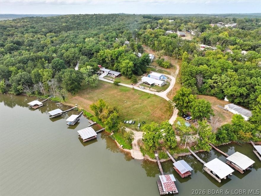 Adorable Turn Key Home, Newly updated with Jetted Tub/Shower Combo, Carpet & Laminate flooring AND a TREE House for extra FUN. The one well dock is perfect to fish off of or put your fishing boat. This home offers 2 bedrooms and a bonus room with extra storage, bunk beds and room for a freezer for that Deer meat and Crappie! Plenty of parking r guests, lake access close to the dock with a common area for picnic's, playing volleyball or frisbee. Close to downtown Warsaw, Drake Harbor and shopping. Schedule through Showing Time.
