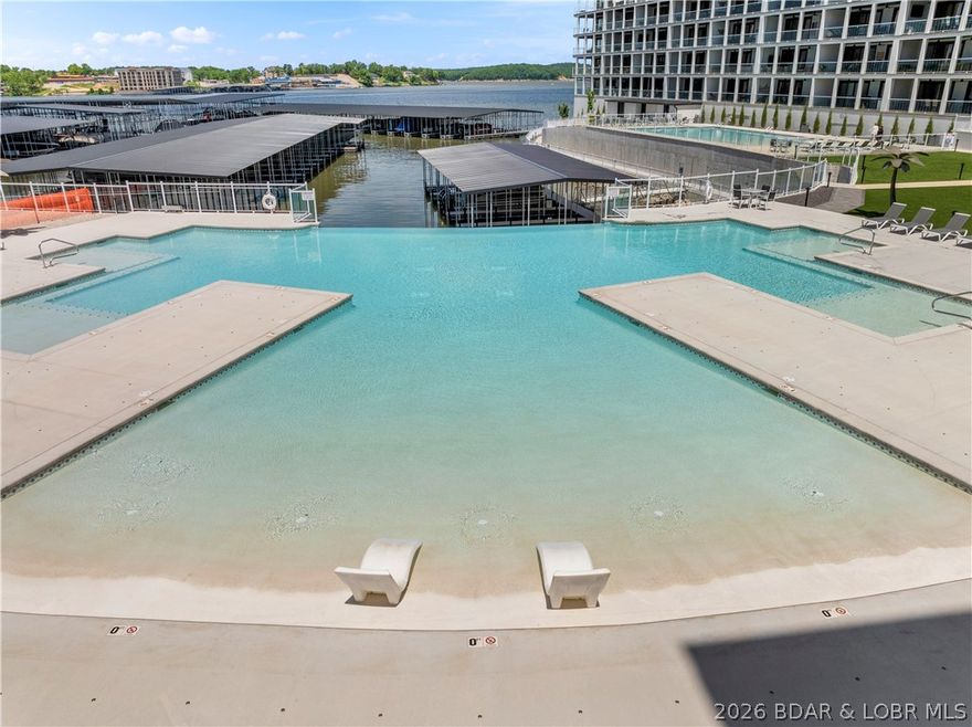 This is you chance to get a Topsider Condo at a great price before the Lake Oasis goes in. Step into easy lakefront living with this beautifully turn key bottom-level residence at Topsider. This spacious 3-bedroom, 3-bath condo offers seamless one-level living w/ an open-concept design, soaring 9-foot ceilings, & floor-to-ceiling glass that fills the main living area with natural light. Enjoy expansive main channel views from your private covered deck—an ideal space to relax or entertain while taking in the lake scenery. Inside, you’ll find granite countertops, a massive tiled walk-in shower, & a thoughtful layout that perfectly balances upscale design with everyday comfort. Topsider delivers true resort-style amenities, including a stunning waterfront pool, sun decks, luxury cabanas, fire pits, grilling areas, elevator access, and a community dock—everything you need for the ultimate lake lifestyle. Located in the heart of Osage Beach, just minutes from premier shopping, dining, and popular attractions. With rentals allowed, this property is perfectly suited as a full-time residence, weekend retreat, or a strong investment opportunity.