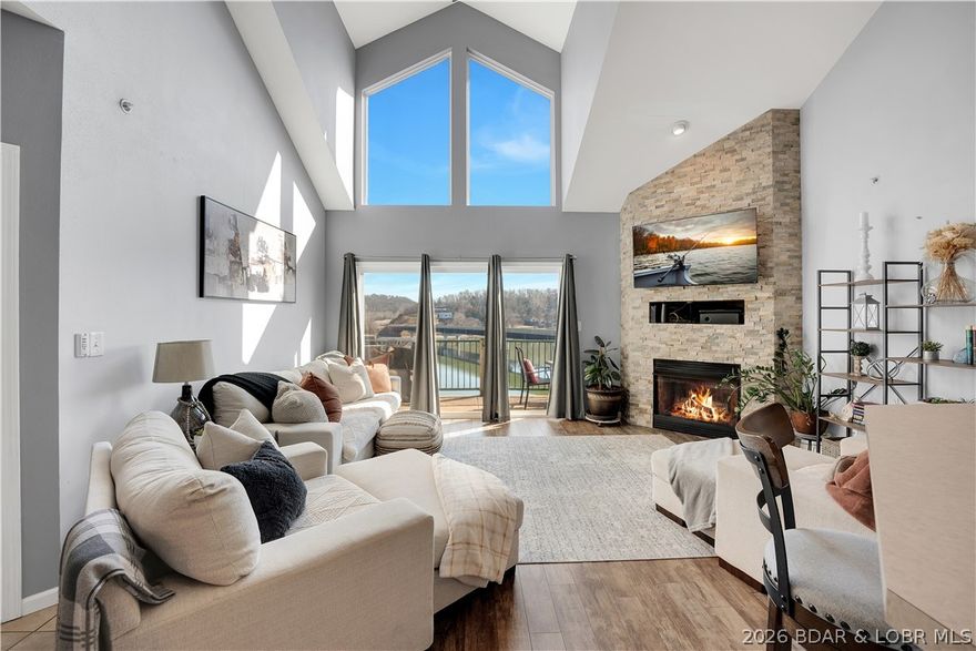 Experience lake living in this 4-bedroom, 2-bath penthouse condominium with approximately 1,923 sq ft in Cedar Heights—perfect for a family getaway! The open layout features vaulted ceilings, abundant natural light, and a stone fireplace. Two outdoor spaces—a screened deck and sun deck—are ideal for relaxing and enjoying the views. The kitchen offers stainless steel appliances, a spacious peninsula, and tile backsplash. The primary suite includes vaulted ceilings, a walk-in shower, and walk-in closet. A second bedroom connects to a Jack-and-Jill bath, with an additional main-level bedroom. The upper-level loft provides flexible space plus a fourth bedroom with walk-in closet and plumbing for a potential third bath.

Located in a calmer water area, this condo is perfect for swimming, floating, and lake fun. Includes a 12x30 boat slip. Community amenities feature three pools and maintained common areas. Convenient to golf, dining, shopping, entertainment, and Ballparks National. Seller will pay all levied special assessments. Nightly rentals allowed. Offered furnished for a turnkey experience; some antiques and personal items not included. Don’t miss this fantastic lake condo!