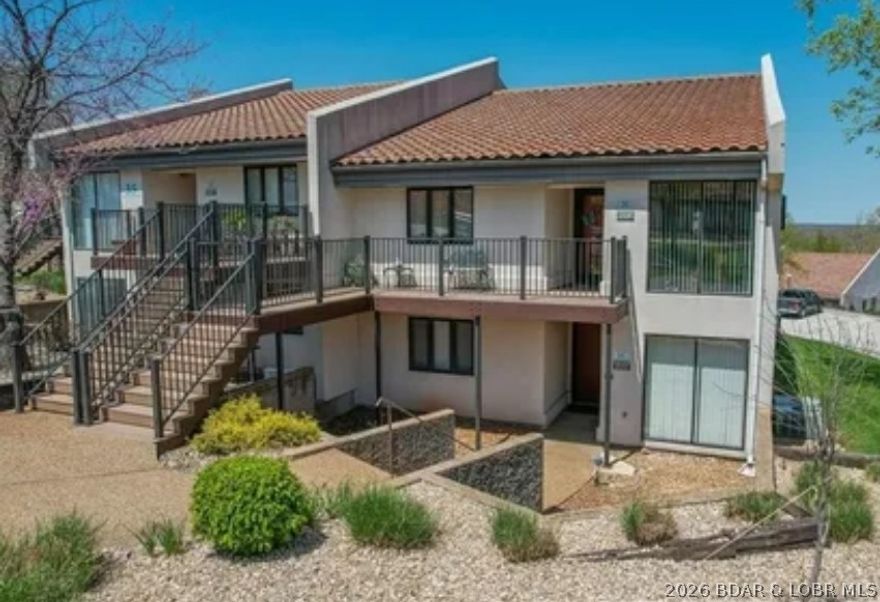 This ground-floor, 1-story, end unit offers plenty of room for everyone!  This spacious 2 bed, bath unit provides lots of room to gather for fun activities. Recent updates include:  stacked washer/dryer, HVAC, upgraded cabinets, solid surface counters, stainless kitchen appliances, and new water heater.  To complete this perfect picture, enjoy your morning coffee in the front courtyard or screened porch watching the beautiful sunsets, nature and wildlife while sitting on your screened porch. Want some fun in the sun?  Head over to the pool just a few steps away! OSAGE VISTAS is a lot more than a typical condominium development. Sitting on 44 park-like acres with 6 community swimming pools, Osage Vistas owners can also access other Four Seasons Lakesites POA recreational amenities including additional pools, tennis & pickle ball courts, clubhouse, fitness center, stocked fishing lakes, walking/biking paths, and boat ramps. Want more? You are close to town for shopping, restaurants and golf courses. Rentals are allowed giving the flexibility of making this both an investment opportunity and fun retreat!