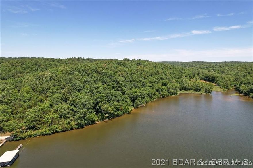 A rare find offering 2,089 feet of gentle shoreline & 17.73 acres of beautiful Lake of the Ozarks land. This exceptional property features a mix of open pasture, valley, hay fields, mature trees, and a spring-fed creek, creating a peaceful and private setting. Abundant wildlife including deer, turkey, and ducks make this an ideal retreat for nature lovers and outdoor enthusiasts. Enjoy fishing, kayaking, and wide-open space to roam. Family owned since 1952, this property presents a once-in-a-generation opportunity to own a large tract of land with extensive shoreline and endless possibilities. Must provide proof of funds and a scheduled appointment only. Sellers agent, owner to accompany all showing (camera/videos on property). Property is occupied and hunted! Trustee for the trust is a licensed real estate agent. DO NOT try to enter property off of Heather rd. and private driveway.