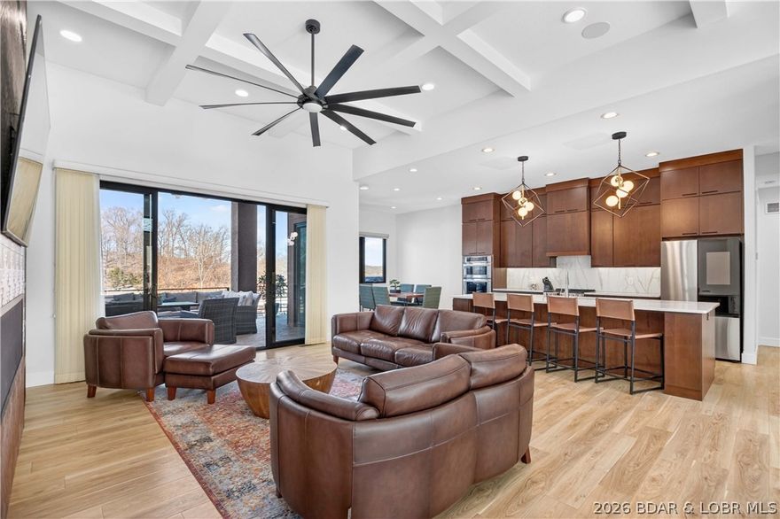 425 Waterside Drive in Camdenton is the kind of luxury lakefront home that makes every day feel like a getaway. Just two years new and lovingly cared for by one owner, it’s being offered fully furnished for a truly turn-key move. Enjoy the ease of main-level living, then step out to expansive outdoor spaces built for sunrise coffee, weekend grilling, and golden-hour gatherings. A second living area with a wet bar creates the perfect spot to host, while additional bedrooms and baths give everyone room to relax. Outside, a level backyard and concrete steps lead to a standout 3-well dock with year-round water and cove protection—complete with multiple zones to dine, lounge, swim, and soak up the sun, plus a fun tiki bar vibe. Thoughtful, low-maintenance landscaping keeps weekends focused on the water, and you’ll love the attached 2-car garage with plenty of extra parking for guests. By water at Four Corners with quick access to The Fish & Co, Mariners Pier 31, and Larry’s on the Lake—schedule your private showing and experience the lifestyle in person.