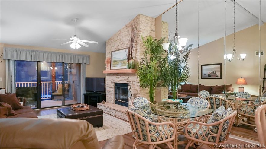 Top floor, vaulted ceilings, fully updated, furnished and vacation rental ready at Lazy Days on the 3 mile marker of the Grand Glaize arm in Osage Beach. Unit W11 is a 2-bedroom 2-bath Lake of the Ozarks condo that has been done right with new LVP flooring, new stainless appliances, new quartz countertops, a stone fireplace and a large screened deck with storage closet is exactly where every lake day should end. The 12x30 boat slip is included and puts you on the water fast. Lazy Days is one of the best managed condo complexes on Lake of the Ozarks and it shows in one detail that matters more than most people realize. It qualifies for conventional financing which means your buyer pool stays broad, your resale value stays strong and buyers can purchase with standard loan terms instead of being forced into portfolio or cash deals like other complexes that do not meet the warrantable standard. Owners and guests can swim directly off the no wake cove dock, the State Park surrounds the complex so that setting never changes, the Shootout finish line is visible right from the property, and the nearly $500 million Oasis at Lakeport resort is just down the road. Vacation rentals Allowed.