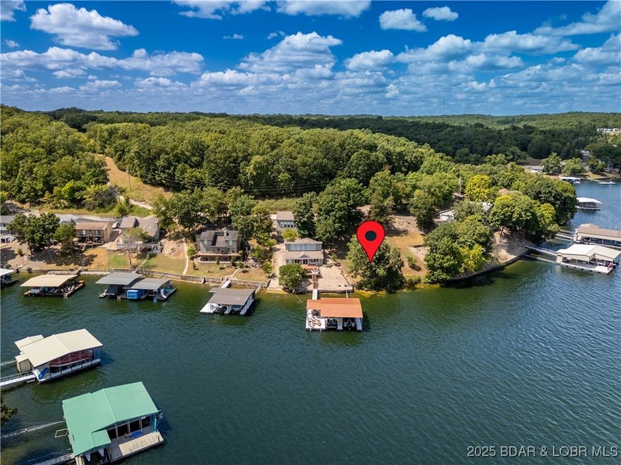 Discover one of the most desirable lakefront opportunities at Lake of the Ozarks! This prime lot boasts 100 feet of shoreline with gentle topography, making it ideal for building your dream lake home or a weekend retreat. The property offers blacktop access all the way to the lot for easy convenience, along with sweeping, unobstructed views of the main channel of the Gravois Arm. Located right next to the iconic Coconuts Bar & Grill, you’ll enjoy being in the heart of the action while still having your own private slice of the lake. Whether you’re looking for a personal getaway or a fantastic investment, this lot checks every box — lakefront, location, and lifestyle.