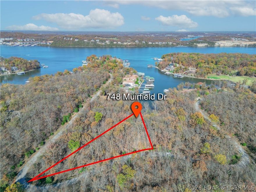 Lot 748 Muirfield Dr in Porto Cima offers a fantastic opportunity to build your dream home at Lake of the Ozarks in the sought-after Heritage Isle community. This 1.12-acre residential lot features approximately 357 feet of road frontage, giving you room to design with flexibility, privacy, and curb appeal in mind. Enjoy access to Four Seasons amenities, including community pools, tennis courts, playgrounds, campground access, and a fitness center. Create the lifestyle you’ve been dreaming of in one of the lake area’s premier neighborhoods.