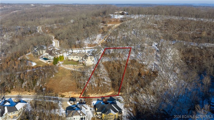 Imagine waking up to peaceful lake views and ending your day with nice sunsets over the Big Niangua Arm at the 3 mile marker of Lake of the Ozarks.  This second tier lot in the prestigious Spyglass Subdivision offers the perfect blend of privacy, with a little over ½ acre, scenery, and upscale surroundings.  Sewer and electricity are already in place, making your building plans that much easier.  Enjoy the feel of lakefront living without the waterfront price, all in a well established neighborhood.