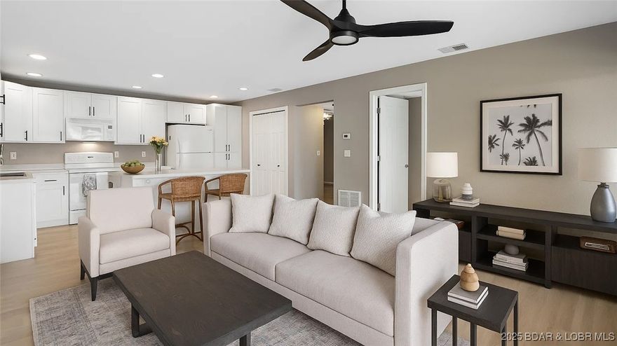 Beautiful condo with a walk-out ground-level deck and two steps down to your boat slip, complete with a lift! Water level views from the entire condo, including the master bedroom. You can see your boat slip right from the unit. Recently updated kitchen cabinets, trim paint, and flooring. This complex is excellent for the investor or full-time summer ownership. The gated complex offers an indoor pool, outdoor lakeside pool, a boat ramp, a tennis court, basketball, and a playground. Close to all the hot spot entertainment areas and restaurants at the 12-mile marker. Close to the Bagnell Dam strip.