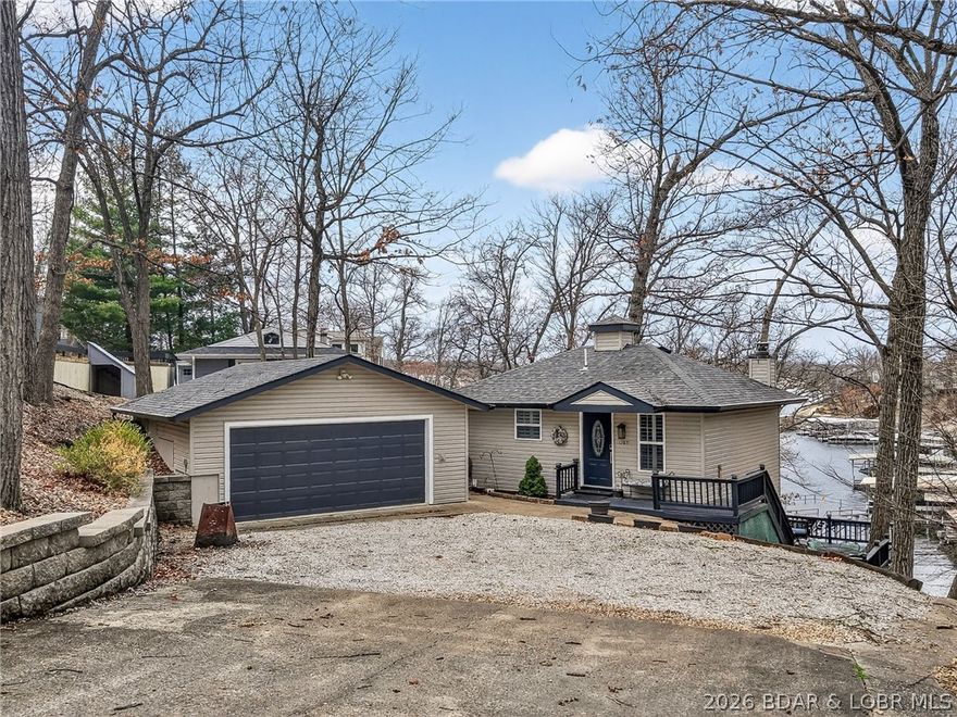 Are you ready for Summer! Lake Season has begun!! Immaculate bungalow in the heart of the lake! Double lot provides both wooded area and lake views with privacy in quiet well maintained neighborhood, yet located near all of the conveniences and fun at the lake. 23x22' master bed w/ lake views. Move into the LL & out on the deck for your morning coffee on your expansive deck.  Newly remodeled main bathroom w/ jetted tub. Heated bidet seat.  Smart home features include thermostat & coded door locks to operate remotely. This home is on first tier, and has a long and wide double garage that easily fits your truck, and still has room for tools or lake toys including a built in work bench. The set up of the home is ideal for quick hot water to every spot with the brand new 50 gal hot water tank. It also enhances heating up the entire home via your wood burning fireplace…firewood included! Seer 21 Trane HVAC only 5 years old. Enjoy your second home at the lake, or as a first home, because you will not want to leave! Washer & Dryer & Garage Fridge Included. Possible Day Dock. Seller is using a marina right across the bridge less than 5 min