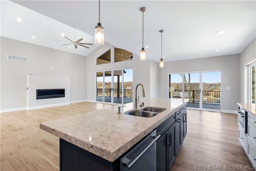 5499 Deephaven Lane in the sought-after Harper’s Cove subdivision in Osage Beach offers exceptional new construction designed for the Lake of the Ozarks lifestyle. This approximately 3,400 sq ft home features 4 spacious bedrooms, each with its own private en-suite bath, plus 2 additional baths for a total of 6. Positioned in a peaceful cove setting, the home captures beautiful water views and offers over 1,360 sq ft of outdoor deck space ideal for relaxing or entertaining.

The main level features a gourmet kitchen, walk-in pantry, open great room with fireplace, and convenient main-level laundry. The lower level is designed for gathering and guest comfort with 3 en-suite bedrooms, two offering private patio access, a half bath, and a large entertainment area complete with a wet bar.

A 14x44 boat slip is included, along with golf cart parking, an oversized 3-car garage, and convenient access to the community dock and pool. Located just minutes from the hospital, shopping, restaurants, and many of the Lake of the Ozarks’ most popular attractions, this home offers an exciting opportunity to own in the highly anticipated Harper’s Cove community.