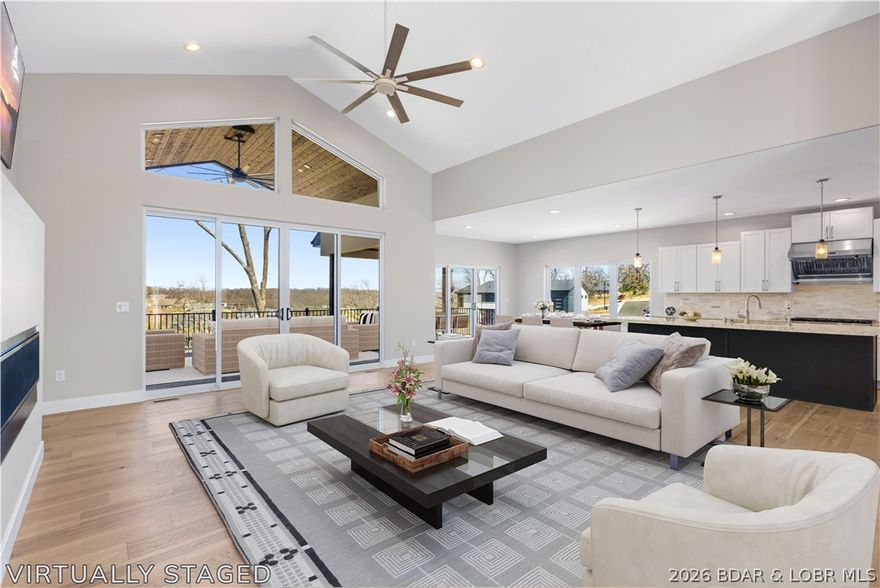 5499 Deephaven Lane in the sought-after Harper’s Cove subdivision in Osage Beach is back on the market through no fault of the sellers—presenting another opportunity to own this exceptional new construction at the Lake of the Ozarks.

This approximately 3,400 sq ft home features 4 spacious bedrooms, each with its own private en-suite bath, plus 2 additional baths for a total of 6. Positioned in a peaceful cove setting, the home captures beautiful water views and offers over 1,360 sq ft of outdoor deck space ideal for relaxing or entertaining.

The main level includes a gourmet kitchen, walk-in pantry, open great room with fireplace, and main-level laundry. The lower level is designed for gathering and guest comfort with 3 en-suite bedrooms, two offering private patio access, a half bath, and a large entertainment area complete with a wet bar.

A 14x44 boat slip is included, along with golf cart parking, an oversized 3-car garage, and convenient access to the community dock and pool. Located just minutes from the hospital, shopping, restaurants, and many of the Lake of the Ozarks’ most popular attractions, this home offers a rare second chance in the Harper’s Cove community.