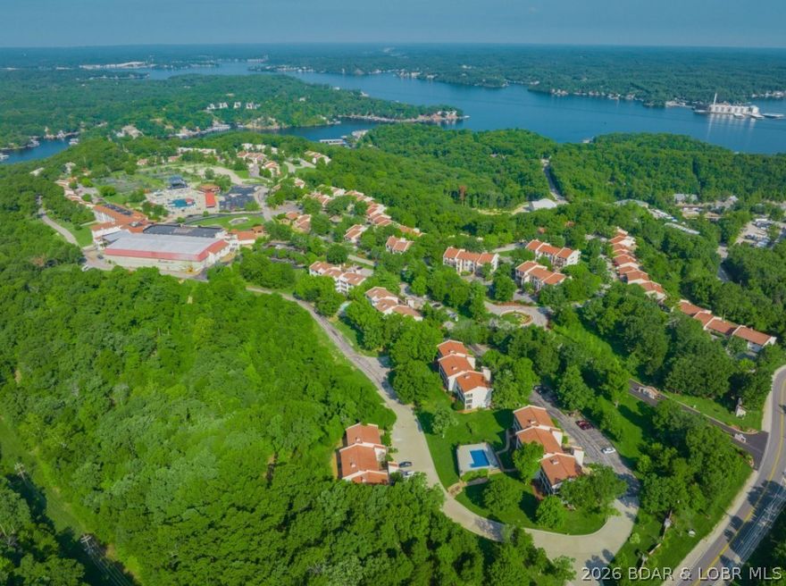 Spacious 2-bedroom, 2-bath condo in Osage Vistas (formerly Four Seasons Racquet & Country Club), set on 23 acres of beautifully landscaped grounds. Conveniently located off Horseshoe Bend Parkway and just 10 minutes from shopping, restaurants, and nightlife. This community features its own marina and includes access to Four Seasons amenities.
This second-floor unit, with minimal steps, offers a comfortable layout with open living and dining areas. Enjoy the sunroom with views of one of the community’s six pools, along with a panoramic treetop view of the Ozark hills—bringing a relaxing, elevated feel from inside the home.
The split-bedroom design provides added privacy. Both bathrooms feature jetted tubs and separate walk-in showers, creating a spa-like experience.
Ideal for full-time living, a weekend getaway, or an investment opportunity. 1-year home warranty included.