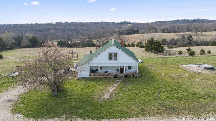 Experience the perfect blend of country charm and wide open opportunity with this beautiful farmhouse setting nestled on 60 acres of fenced pastureland. Designed for those who appreciate rural living, the property features a reliable water source for livestock, making it ideal for cattle operations or a horse ranch. The gently rolling acreage offers endless possibilities whether you're looking to expand an agricultural venture, create a private retreat, or simply enjoy the peace and quiet of the countryside. Despite its serene setting, this property is conveniently located just minutes from Osage Beach, giving you easy access to shopping, dining, and the Lake of the Ozarks. If you've been dreaming of a place where hard work meets tranquility, this one checks all the boxes.