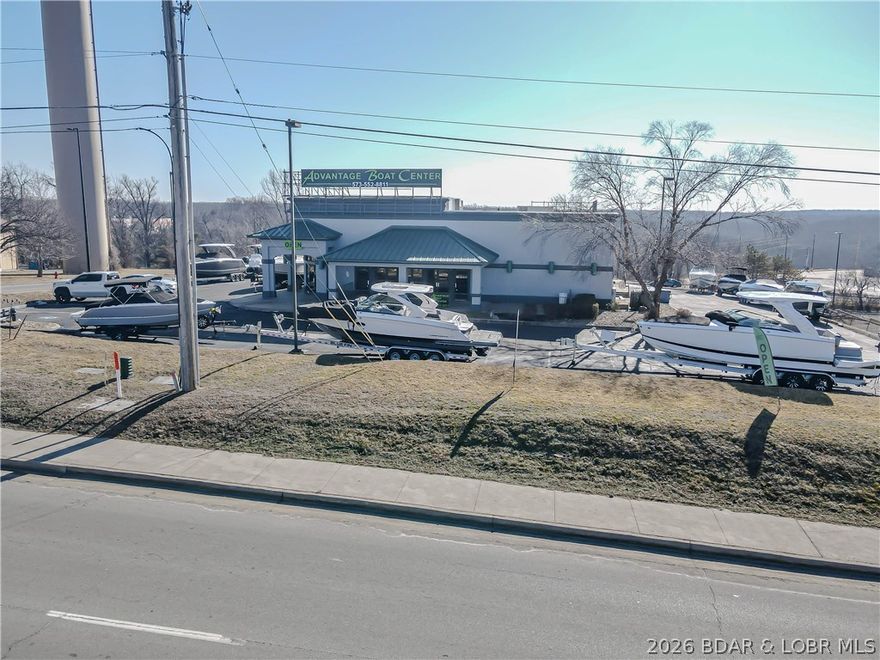 Prime commercial opportunity in the heart of Osage Beach, positioned at the entrance/exit of a high-traffic Walmart—delivering exceptional visibility and steady daily exposure. Situated on a 1.2± acre corner lot with 164’ of Hwy frontage plus additional side-road access, this 5,657± SF building offers outstanding accessibility and parking.  Originally built as a successful Pasta House and later operated as a Mexican restaurant, the property is already configured for food service with kitchen, bar, and dining areas in place. The current owner utilizes the space as a sales lot, making this a flexible opportunity for restaurant, retail, or showroom use. Built in 1996, the site benefits from strong traffic counts, excellent sightlines, and ample outdoor parking. Located in one of the Lake area’s fastest-growing commercial corridors with heavy tourism and local demand, this property is ideal for operators or investors seeking a high-exposure location with proven history. Rare corner positioning, established infrastructure, and unbeatable visibility make this a standout redevelopment or owner-user opportunity.  Roof air handlers were recently replaced.