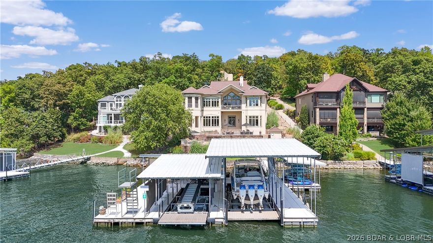 Lake of the Ozarks, home to stunning waterfront luxury in the heart of the Midwest. This home, located at 775 Grandview Dr, is just that. Stepping inside this waterfront masterpiece you'll find the home situated in a cove with main channel views just off the 14 Mile Marker. The residences features 7 bedrooms and 7 bathrooms. The upper level of the home features: dining, living, office, two guest rooms, laundry and a stunning lakeside master bedroom suite. Travertine flooring throughout, cambria countertops, a dream kitchen and outside screened in patio area. As you head downstairs, let the games begin. Large entertaining area with pool table, custom bar, two lakeside suites, two additional bedrooms, laundry, storage and much more. As we head out to the pool deck you're greeted with a private heated pool and custom dock ready to soak in those Lakeside memories. Carefully manicured landscaping, waterfall feature with few steps from pool deck to dockside. The dock features 18x52 slip, 12x30 slip and 12x12 slip perfect for PWC's. We invite you to head down and tour what Luxury looks like here at Lake of the Ozarks. Ck out the Live Virtual Tour! https://youtu.be/X0DQopsI5nE