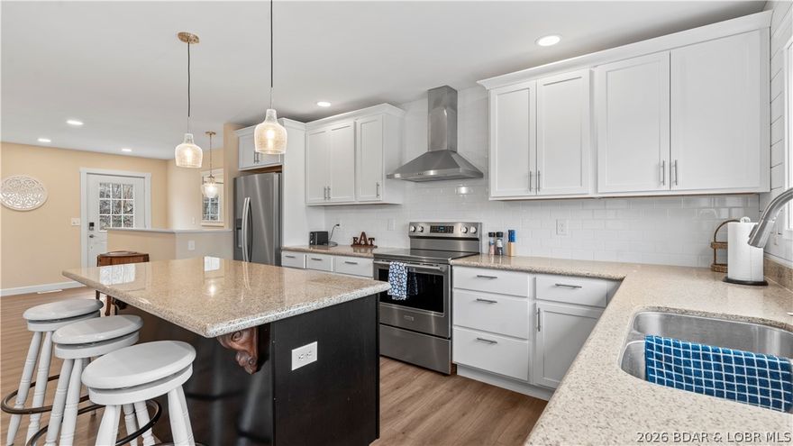 This is the kind of lake property people wait for—and the kind that rarely stays available for long. This brand-new 3-bedroom, 2-bath townhome delivers that effortless blend of luxury and comfort. Purchased at the stud stage and finished to an exceptional standard, it offers the rare advantage of everything being completely new—beautifully done and ready for immediate enjoyment. The interior is light, open, and thoughtfully designed. Luxury vinyl plank flooring, granite countertops, and Pella windows create a clean, elevated feel throughout. A custom tiled shower, stylish dry bar with wine cooler, and a cleverly designed bunk room add both charm and function—while all-new mechanicals ensure peace of mind. Outside, the setting truly shines. With no neighboring property to the right, you’ll enjoy privacy beneath mature trees, whether relaxing on your lakeside deck or rinsing off in the private outdoor shower. A golf cart path makes lake access easy and inviting. A 10’ x 20’ boat slip is included, giving you instant access to the water. Offered fully furnished, with room to add a garage or additional parking, this is a turnkey opportunity that checks every box.