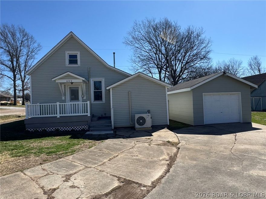 Completely remodeled 2-bedroom home located in Cole Camp! This move-in ready property features numerous updates including a newer roof, updated heating and cooling system, new flooring, and fresh interior paint. The home offers a comfortable layout with modern finishes throughout. A detached garage provides additional storage and parking space. Conveniently situated within walking distance to downtown Cole Camp, giving you easy access to local shops, dining, and amenities. A great opportunity for a primary residence or investment property!
