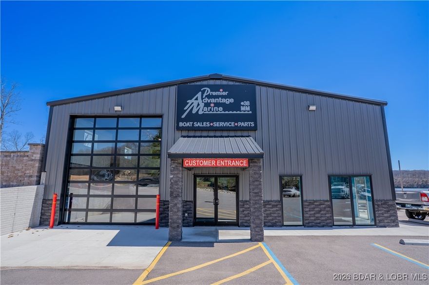 High-value, marina with great income possibilities just off Hwy 5. This prime waterfront property offers exceptional visibility, access, & multiple established revenue streams including possible boat sales, service/repairs, parts/accessories, fuel dock, convenience store, indoor/outdoor storage, and in/out services. Operate as a full-service marina or reimagine the property as a bar/restaurant, pool destination, or entertainment concept. The newly constructed 8,000± SF building features showroom, 6 offices, break room, 2 restrooms, conference room, & 5 service bays. Fuel dock includes 5 wells, 2 jet ski drive-ons, and dual 87/91 pumps, plus a newer concrete dock. Adding value is a 20-acre parcel across the road with a 24,000± SF indoor storage facility & a remodeled 2,000± SF home ideal for manager housing or rental income. This property is within walking distance of marina and the 2 pieces work well together. Endless potential in a booming lake market—own one of the most versatile marina properties at the lake. Nearly 540 feet of shoreline and plenty of parking, come by land or water. The lake is moving this way, combine with highway store (for sale) for a rare combination marina.