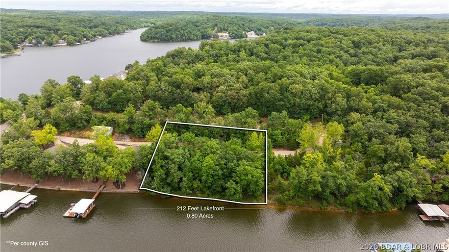 Are you looking for a lakefront lot that has it all? Well, look no further! Situated on the 6 mile marker of the Gravois arm, this gem provides a gentle topography, is a double lakefront lot, has roughly 212 feet of lakefrontage, and 0.80 acres. Cove protection, access to a shared well, and subdivision boat trailer parking are all huge advantages as well. The property conveniently sits between Coconuts Caribbean Beach Bar & Grill and Jolly Rogers for those that love lakefront entertainment. The Gravois arm is known for its laid back lifestyle and great fishing, so come and build your dream house here today!