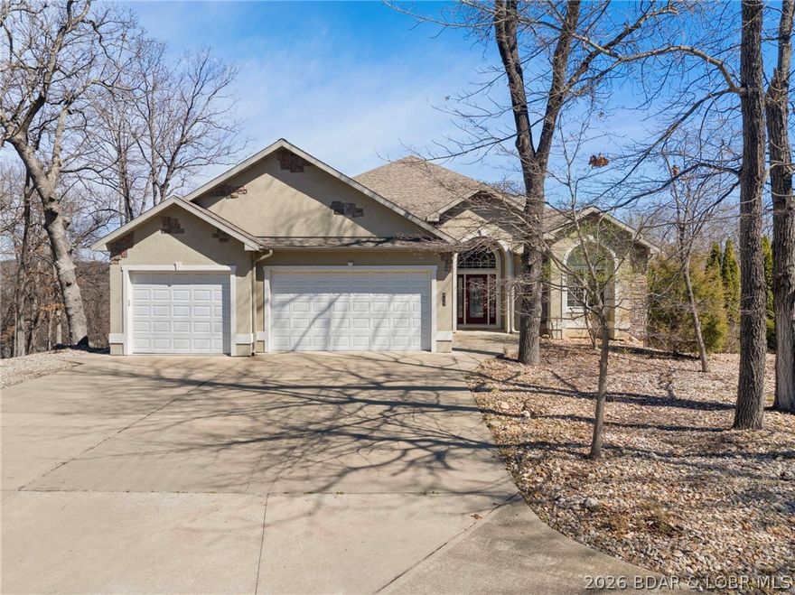 Truly a unique find in the heart of Osage Beach. This estate type property features over 5 acres of property, a large Traditional ranch style house over a walkout basement, and two shop buildings. The house provides an attached 3 car garage and an RV garage attached to the rear. The kitchen boasts beautiful, solid wood cabinets, Corian counter tops, and quality appliances. The great room features many windows to provide an abundance of natural light, gas fireplace, spacious dining area, and cozy sitting nook. The master suite provides a massive walk in closet and large bathroom with walk in shower, jetted tub, and double vanity. The lower level provides a large open space that would be great for a game room and kitchenette. There are two shops on the property. The large shop measures 56' wide x 48' deep, 16' tall ceiling, and an overhead door that measures 16' wide x 10' tall. The large shop is climate controlled and provides a bathroom. The small shop measures 30' wide x 50' deep, and provides a 12' wide x 10' tall overhead door. This property is perfect for the buyer that needs storage for all of their toys.