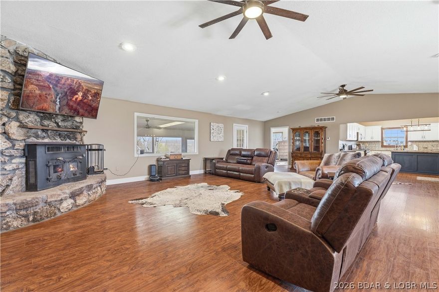 Discover the perfect blend of comfort, functionality, and rural charm with this exceptional 80-acre turnkey cattle farm. The updated 3,028 sq ft home offers 4 bedrooms and 4 bathrooms, fully remodeled in 2019 with modern finishes throughout. The land includes 75 acres of pasture and 5 acres of woods, fully fenced and crossfenced for rotational grazing, with three ponds and four automatic waterers. Outbuildings include a 40x60 barn with 15-foot lean-tos and 100-amp service, a 22x40 open-front three-car garage, a 12x24 insulated six-run dog kennel with heating and cooling, a 10x14 well house with storage, a chicken coop, and two garden areas. A storm shelter sits just off the back patio. Inside features an open-concept layout with a large mudroom, laundry, guest bath, and kitchen flowing into the living area. The primary suite offers a walk-in shower and a Jack-and-Jill vanity. Three additional bedrooms provide flexible space. Dual HVAC systems and separate water heaters add efficiency. Enjoy peaceful views from the front patio and relax on the screened-in back patio. Move-in ready and fully set up for cattle or country living.