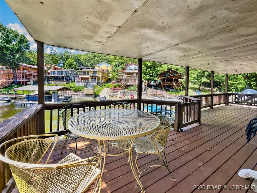 This lake home has it all for 1 price - Boat, 2 PWC's, Paddle boat, Kyak, completely furnished all included with this cute 2 bedroom home on Lake of the Ozarks. Day dock with two drive on PWC lifts as well as the wet steps, make it easy to play off of your dock or hop on one of your toys to enjoy the lake and the local restaurants and pubs. House comes completely furnished as you see in the pictures, everything stays, (turn key). Start enjoying your lake lifestyle the very first day. Home has been a place of great enjoyment for years by the current owners. Make your appointment now so you can start enjoying your Lake life style today.