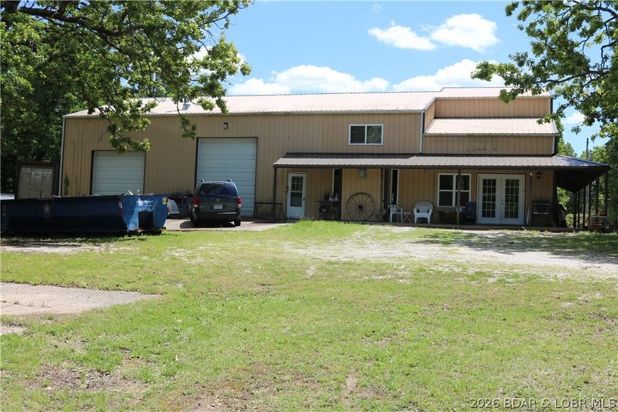 LARGE COUNTRY HOME WITH HIGHLY DESIRABLE LOCATION. ALMOST 4200 SQUARE FOOT UNDER ROOF WITH 1760 SQUARE FOOT BEING FINISHED GARAGE SPACE WITH 16 FOOT CEILING AND 12-FOOT-TALL OVERHEAD DOOR.  THIS THREE BEDROOM, THREE AND ONE HALF BATH OFFERS CHARM YET EASY LIVING SIMPLICITY. YOU WILL LOVE THE GOURMET KITCHEN WITH CUSTOM HICKORY CABINETRY AND HUGE PANTRY. ENORMOUS MASTER SUITE WITH TREMENDOUS HUGE WALK IN SHOWER. ENJOY THE COVERED PORCH AND LOVELY QUIET SETTING WITH PLENTY OPPORTUNITY FOR WILDLIFE VIEWING, GARDENING, EXPANSION AND PEACEFUL QUIET COUNTRY LIVING WITH CLOSE TO TOWN CONVENIENCE. THIS PROPERTY HAS OVER SEVEN SURVEYED ACRES WITH SIGNIFICANT STATE RT O HIGHWAY FRONTAGE FOR FUTURE ENHANCEMENT. HOME SITS BACK OFF THE HIGHWAY ISOLATED FROM NOISE AND NEIGHBORS FOR THE PERFECT TRANQUIL SETTING.
