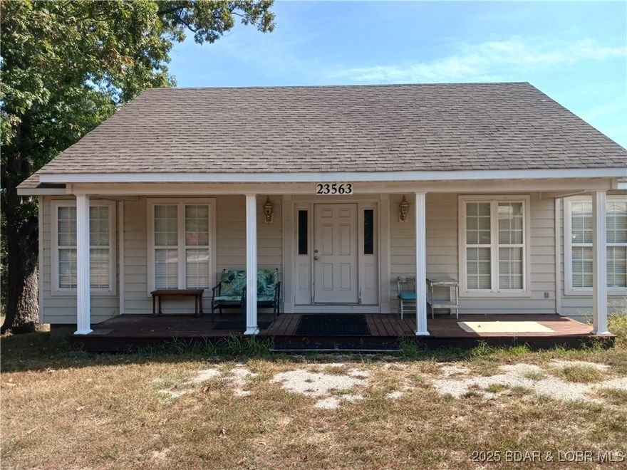 Peace, tranquility and the serenity of nature awaits the future owner of this Cape Cod-style cabin tucked away on 5.3 country acres south of town in Versailles. Fully furnished, with central heat and A/C, this cozy and bright one-bedroom, two-bath haven could be someone's 5-acre piece of paradise. Wildlife watchers will love the newly added sun room that provides a perfect spot to sit and connect with nature, grow plants, take in the sun or watch it snow in winter. Next to the main cabin is a fully insulated building (work in progress with a finished floor and electricity) that could serve as a future guest house, she shed, workshop or man cave. But, wait! There is still more! Located out back only a short walk from the cabin is a roomy storage building that could house boats, cars, lawn equipment, etc., or be converted into a formal garage. Whether you're looking for the perfect vacation retreat, a place for a B&B rental, or full-time residence, this property offers the best of country living; yet, it is only a short drive north to town, and a short drive south to a public boat launch and fishing dock at the Gravois Arm of the 54,000 acre Lake of the Ozarks. Come take a look!