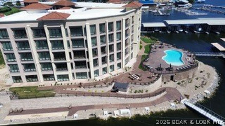 Developer units for sale at The Hamptons in Osage Beach. Top floor unit where the views do not get any better! Step into a world where luxury meets serenity. This gated community is just a short walk to The Oasis, Dog Days and several other lake attractions. With only a limited number of 4/5 bedroom units available, experience grand living in the heart of Osage Beach. These new construction condos have the same great Hamptons on the Lake amenities & location but this is a different builder/developer than the previous buildings. New amenities were also added, a hot tub by the pool, fitness center, a clubhouse, lakeside shuffleboard court, fire pits and a wonderful swim dock! Between the buildings is also a resort-style breezeway. Relax, connect, and unwind in this lounge-setting area against a backdrop of the lake and pool. It is rare to find 4 bedroom condo units at the lake. When you add that this complex doesn't allow nightly rentals, offers nearly 3,000 sq ft, and 4 baths all in this location, Forget about it, this is the one. Finishes are all top notch so stop in today to learn more about these new construction condos. Boat slips are available to purchase up to 18X48.