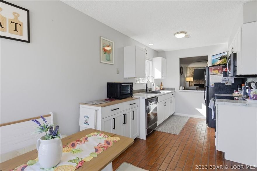 This spacious 1,500 square foot 2BR/2BA condo is located on HH. So, if you like the convenience of being close to popular local restaurants and bars on and off water, shopping, medical services, marinas, movie theaters and more. Plus, this unit is close to 2 pools, tennis/pickleball courts, playground, and several walking areas around the complex. This condo features an oversized enclosed deck which can be used year-round. Entertaining and wanting additional space for family and friends just open the slider in the living room which flows out to the enclosed deck. Also, there is lots of parking for your guests and being located next to the HOA office which allows for extra security. If all of that is important to you then this condo is PERFECT! This is a great opportunity to own a lake home to enjoy year-round or put it on a local rental program and choose the times you want to use it. Call today to see this great condo on The Bend.
