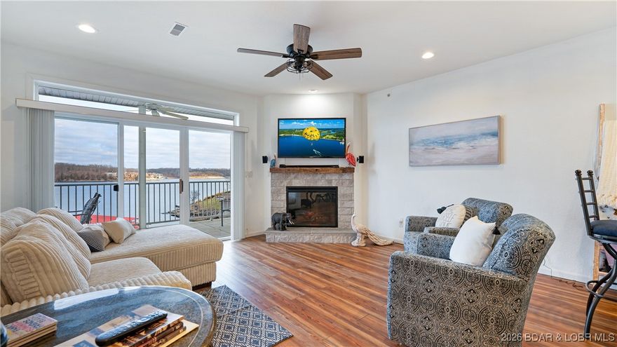 Live the lake lifestyle in one of Osage Beach’s most desirable condo communities, mainly because of its accessibility by land & water and enjoy ZERO maintenance living. This gated & well maintained complex offers stunning views of the Osage 20MM and has elevator access from the parking lot to the pool level and zero steps to the docks! Also includes a 12x30 boat slip! By water, you're just around the corner from the Lake’s most popular restaurants and only 1 mile from the new Lake Oasis amusement park; the location is hard to beat! This updated 3 bedroom, 2 bath lower-level unit is energy efficient and has many recent updates like new LVP flooring, a stone-faced fireplace, tile backsplash & fresh paint.  No nightly rentals allowed which ensures you a quiet, owner-focused community. Lake side you get a large covered patio space, lakeside walkways and of course the breathtaking views, making this a great opportunity for you to get on the water and start making memories.