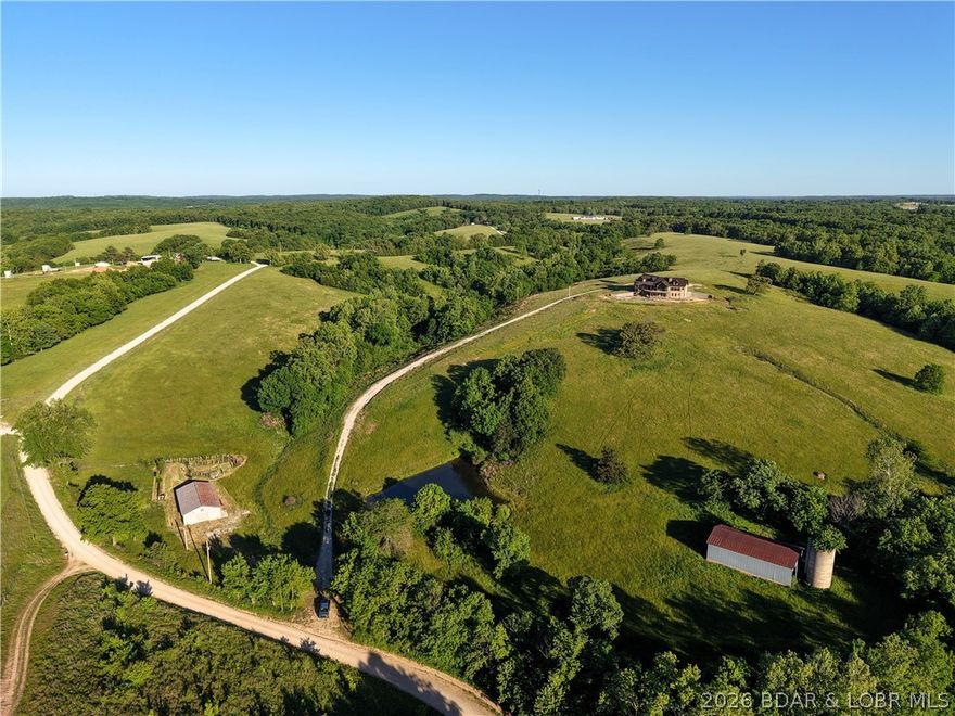A Private Sanctuary of Beauty and Independence.
Just beyond the highway lies 130 fenced acres of rolling pastures and hay fields, water features, and unspoiled nature. It is perfect for a horse or cattle ranch. This distinguished property invites you to finish a 4,000+ sq. ft. custom home to fit your personal style, complete with a three-car attached garage and a detached shop with electric. Designed for discerning buyers seeking both luxury and self-sufficiency, the estate includes solar power with battery backup, geothermal heat, and two wells. Enjoy your own spring-fed pond, creek, and cave — a setting that’s as functional as it is enchanting. Discover the option of off grid living if desired or just feel confident in cases of power outages. There is also room for a private airstrip on the ridge. This property is located just 2 miles off I-44 and is an easy drive to St. Louis, Rolla, Fort Leonard Wood, Camdenton, the Lake of the Ozarks, Springfield and Branson! This property is not just a farm, it is a chance for the Lifestyle you have always dreamed of.