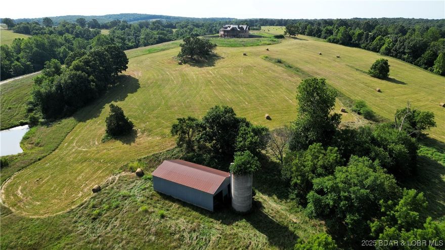 A Private Sanctuary of Beauty and Independence.
Just beyond the highway lies 130 fenced acres of rolling pastures and hay fields, water features, and unspoiled nature. It is perfect for a horse or cattle ranch. This distinguished property invites you to finish a 4,000+ sq. ft. custom home to fit your personal style, complete with a three-car attached garage and a detached shop with electric. Designed for discerning buyers seeking both luxury and self-sufficiency, the estate includes solar power with battery backup, geothermal heat, and two wells. Enjoy your own spring-fed pond, creek, and cave — a setting that’s as functional as it is enchanting. Discover the option of off grid living if desired or just feel confident in cases of power outages. There is also room for a private airstrip on the ridge. This property is located just 2 miles off I-44 and is an easy drive to St. Louis, Rolla, Fort Leonard Wood, Camdenton, the Lake of the Ozarks, Springfield and Branson! This property is not just a farm, it is a chance for the Lifestyle you have always dreamed of.