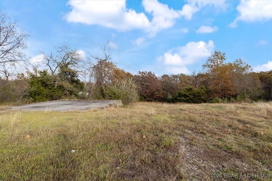 This is the LAST REMAINING commercial lot with direct ingress and egress on Hwy 54. 2+ buildable acres that can be expanded for up to 8.7 acres with excavation and fill. The buildable 2+ acres is flat and has access to sewer and water. This is the last opportunity to buy property ready to build with Hwy 54 access. When this is sold, there are no more available lots along Hwy 54 for development.
