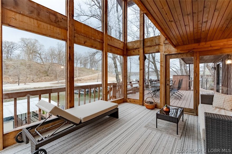 Lakefront bliss in a tranquil cove. This 4-bedroom, 2.5-bath home blends relaxed lake living with effortless entertaining, and it truly stands out with its dramatic design and thoughtful conveniences.
Key features:  Two-well dock with deep-water access, ideal for boats, water toys, and sunset cruises
Unique tram serving every level, stopping at each floor down to the lake for easy loading and unloading Dramatic two-story sunroom facing the lake, filling the home with natural light and cove water views
Four spacious bedrooms and 2.5 baths offering flexible living spaces for family and guests
Located on a quiet cove for tranquil waters, privacy, and prime boating access
Inviting outdoor living areas, including lakeside decks that capture the serene setting.  The open interior flows naturally from living spaces to the sunroom, with lake views from multiple rooms. Whether you're hosting al fresco dinners, enjoying a sunset from the sunroom, or boating from the dock, this home is built for memorable lakefront living. Schedule your showing today!