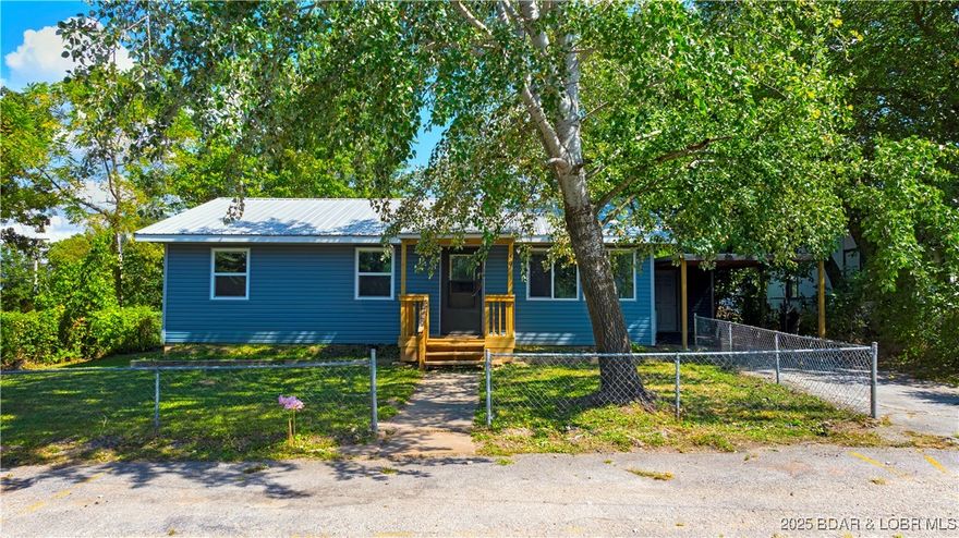 Charming Fully Renovated Home in Camdenton!
Welcome to 50 Hazel Street, where modern updates meet cozy comfort. This home has been completely transformed—taken down to the studs and rebuilt with brand new drywall, paint, flooring, appliances, cabinets, countertops, and vinyl siding. A mini-split HVAC system ensures year-round comfort and energy efficiency.

Situated on a flat, fully fenced lot, the property features both a front and back fenced yard perfect for pets, play, or gardening. A carport in the back provides covered parking, and the screened-in porch is ideal for enjoying the outdoors in comfort. There’s also a large unfinished storage area offering endless possibilities for a workshop, hobby room, or extra storage.

Located just minutes from local schools, shopping, dining, and all the amenities of Camdenton, this move-in ready home offers the perfect combination of convenience, style, and peace of mind.