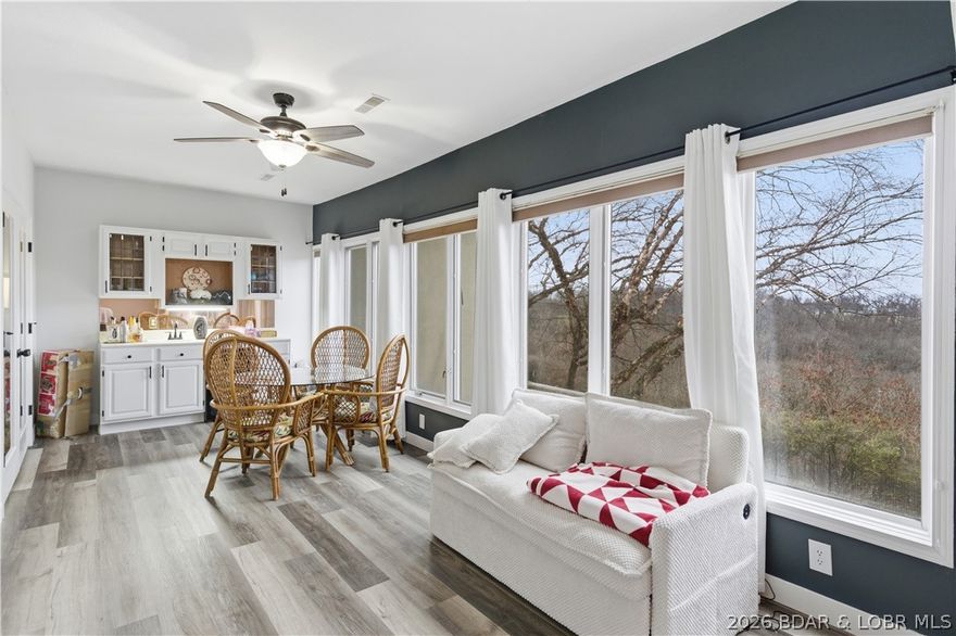 Welcome to the Four Seasons Racquet Club on Horseshoe Bend at Lake of the Ozarks, where lake living meets convenience & investment potential. This updated 3-bedroom, 2-bathroom condo offers beautiful lake views and rolling hill scenery, creating the perfect setting for a relaxing lake getaway or full-time residence. The unit comes fully furnished, making it ready for immediate enjoyment or use as a vacation rental. Inside, you’ll find an open living space designed for comfort & entertaining, along with a private deck. The spacious bedrooms provide plenty of room for family and guests, making this condo a perfect retreat for weekend escapes or extended stays. Located in the highly desirable Four Seasons community, owners & guests enjoy access to outstanding amenities including indoor & outdoor swimming pools, a fitness center, & a boat launch for easy lake access. Positioned in the heart of Horseshoe Bend, you’re just minutes from lakefront dining, golf courses, marinas, shopping, & entertainment. Whether you’re searching for a Lake of the Ozarks vacation getaway or a short-term rental investment, this property offers the ideal combination of location, amenities, & lake views.