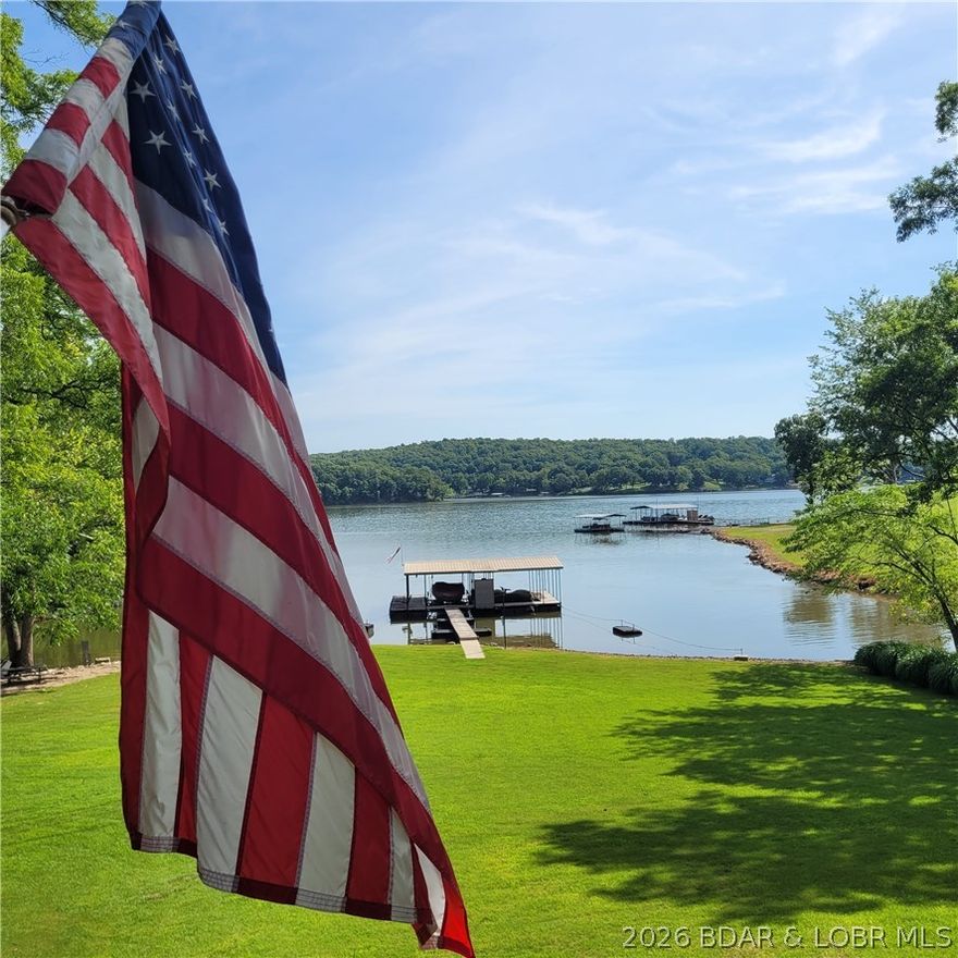 Lake living with lots of space!!WATERFRONT property, TWO homes and a 2-well dock to accommodate lake time fun!! Main home is a wonderful 2 bed/2 full bath at the 75MM. One level living with windows expanding the entire length of the home showcasing a beautiful view of the water! Custom kitchen cabinets. Spacious living room with a wood-burning fireplace. Master bed and bath with jacuzzi tub. Step into additional living space off of the kitchen that is currently used as office space but could be utilized for room for extra guests, and the laundry and utilities are conveniently accessible and cleanly tucked away behind closest doors. Expansive deck with plenty of room to entertain. Still need more space? A SECOND HOME that is 2 bed\1.5 bath(864sqft) has been used as storage space but could be converted back to additional living quarters with some upgrades. PLUS a 24'x32' insulated detached garage with concrete floors and 110 amp service. A gentle walk to the water on zoysia grass. Very few neighbors, a gated entrance and security features around the property for peace of mind. You can't find a waterfront property that has all these amazing features at this price!!