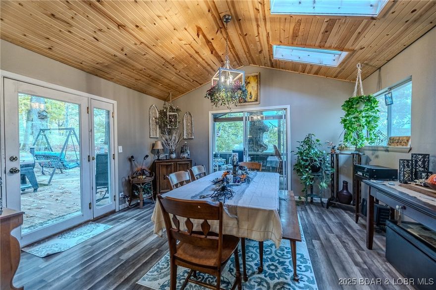 Escape to your own slice of the lake with this 3 bedroom 2 bath home nestled in Bauer Estates off of the the Big Niangua MM 15. Situated on .45 acres. Enjoy access to your own private dock (no electric) located just a short walk, on the community easement grounds. Inside you'll find an open concept kitchen/living and dining area with vaulted ceilings. Take in the amazing views from the new screened in deck! The She-Shed is currently being used as a home office, offering a great flexible work space. Other highlights include: Community well & septic, 3 year old metal roof, boat trailer parking, generous sized lot, located near beautiful Ha Ha Tonka State Park. This property has that sought after "Lake of the Ozarks cottage vibe" peaceful, charming and ready for you to call it home!