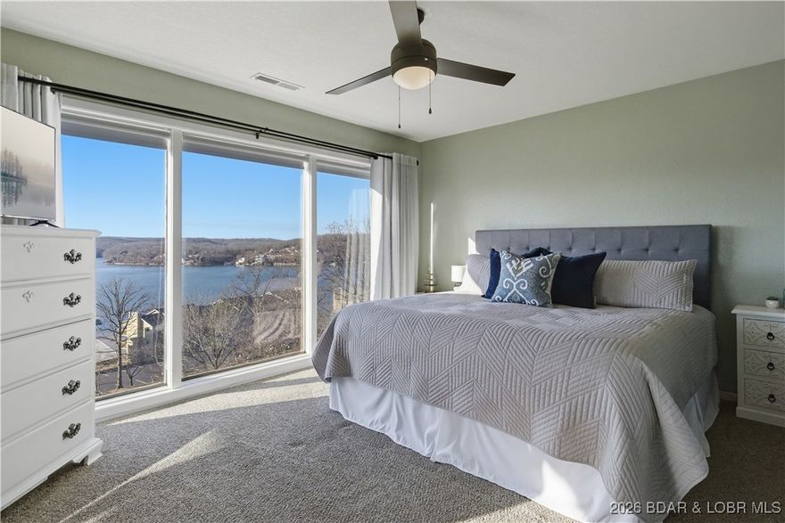 Lake life at its best! This beautifully updated, turn-key, end-unit condo offers everything you need to enjoy the Lake of the Ozarks lifestyle. Step inside to find an open-concept layout filled with natural light and tasteful updates throughout. You’ll love the frosted grid doors, French doors to the laundry area, and crown molding accenting every window and cabinet. Enjoy morning coffee or evening sunsets from your screened-in deck, perfectly positioned with gorgeous views overlooking the 24MM of the Osage Arm. Plus you have your own 10x24 boat slip, making access to the lake a breeze! Various recent upgrades have been completed, so you can move right in and start enjoying lake life. The complex offers incredible amenities — two pools, boat trailer parking, a playground, a fire pit, and lush green space for your furry friends. This condo also includes a locked storage unit underneath. Whether you’re searching for a full-time residence, a weekend retreat, or a smart investment property, this one checks every box. Prime location by land and water — close to all the best dining, shopping, and entertainment the lake has to offer!