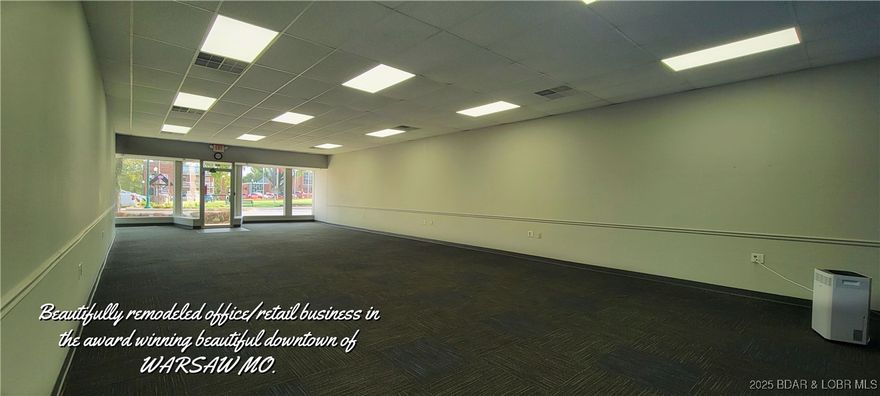 1675 Sq ft in this remodeled property located on main street in the busy Lake of the Ozarks community of Warsaw, MO! Plenty of room in this building for retail or offices. Nicely redone to include 1/2 bath & plenty of storage & shelving. The back room has separate entrance, for a possible sublet. The expansive store front area is set up with high speed fiber optics at several locations. The roof was replaced in 2024, interior & exterior has been recently painted. Newer Zoned HVAC System, flooring & pex plumbing. This building is ready for business! This wonderful community has won several Awards, including Governor's Tourism Award, National Complete Streets Coalition Award, also named "Great Place in Missouri" by the American Planning Association. The building backs up to the historic community building and Drake Harbor, the winner of the 2025 "Best Public Park" award by Heartland Choice Awards. Your business will thrive in this bustling little lake community! Many downtown businesses including restaurants & small boutiques. The many community events brings in thousands of visitors every year. Warsaw, MO is a great place to live & start a new business! Don't let this one get away!