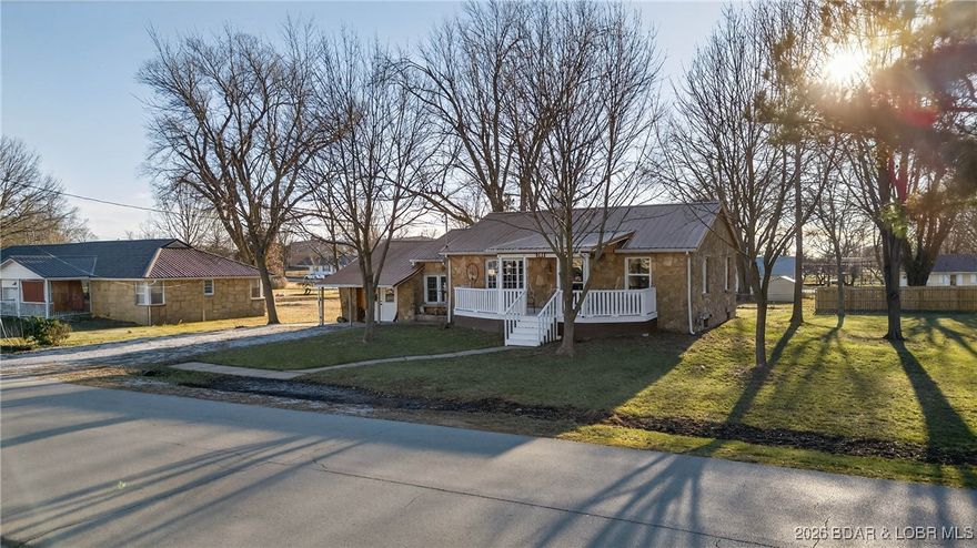 Beautifully updated 3-bedroom, 2-bath rock home with a copper metal roof making it truly unique, as well as being ideally located in Cole Camp, MO. This gorgeous property is just minutes from Main Street and Cole Camp schools, offering both convenience and small-town charm. Inside, you’ll find a stunning, newly updated interior featuring a beautiful kitchen and an inviting living room—perfect for everyday living and entertaining. Thoughtful updates throughout the entire home make it stand out among the rest. An additional adjoining lot is also available, providing extra space for a yard, garden, or future expansion. This is a rare opportunity to own a beautifully finished home in a prime Cole Camp location.