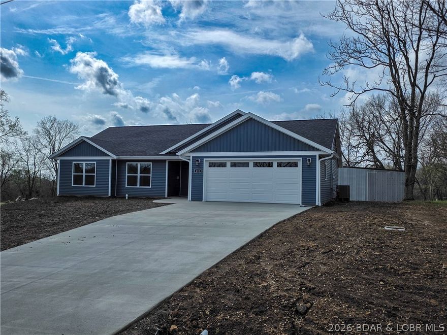 Enjoy small-town living at its best in this beautiful new-build home just a short walk from the courthouse square and only 15 minutes from the Lake of the Ozarks if you're ready for some fishing and boating. Bright and welcoming, this home offers an open living concept filled with natural light, creating a warm and airy feel throughout. The kitchen features a pantry for extra storage, while the spacious laundry room includes a closet for added convenience. The primary suite is designed for comfort with a walk-in closet and private bath featuring a walk-in shower. An attached two car garage gives you extra room for parking, storage, or hobbies. If you are looking for the charm of small town living with easy access to the lake, this home offers the perfect blend of location, style, and everyday function.