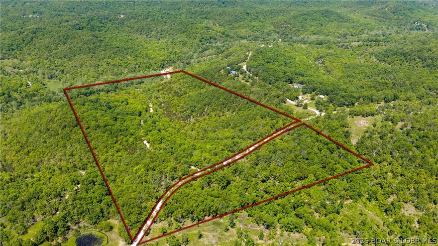 Escape to one of the most breathtaking hidden retreats in the Lake area. This peaceful 81± acre property is an extraordinary opportunity to own a private slice of the Ozarks, complete with a stunning year-round creek winding through the untouched natural land. Whether you dream of building a secluded cabin, creating the ultimate hunting getaway or simply escaping the noise of everyday life, this property offers endless possibilities. Located just down D Road from the nationally recognized Ha Ha Tonka State Park, you are minutes away from some of the best hiking, fishing, and outdoor recreation at the Lake of the Ozarks. Home to one of the largest natural springs in Missouri, the park’s crystal-clear waters help feed the entire Lake and create the incredible scenery this area is known for. The land itself is loaded with character, featuring mature timber, abundant wildlife, rolling terrain, and gorgeous creek rock that could be utilized for trails, roads, or future improvements throughout the property. Privacy and serenity are unmatched, yet you are still conveniently located only minutes from Camdenton and 25 minutes from Osage Beach. A true Ozark paradise waiting to be discovered.