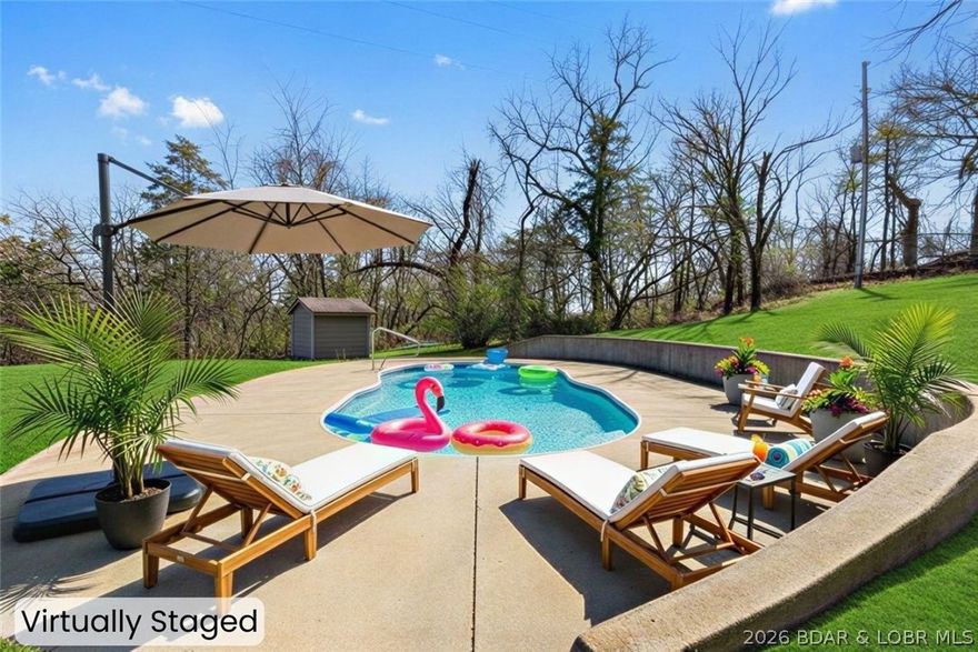 Opportunities like this are hard to find! This recently updated 4 bed, 3 bath home sits on 18 unrestricted acres in a prime location next to Lake Valley Golf Course and just 6 minutes from the Camdenton Square. With 1,255 feet of highway frontage, the possibilities here are endless—whether you're looking for a private retreat, hobby farm, or an investment opportunity. The home features granite countertops, double ovens, a gas range, & modern updates throughout, offering both comfort and style. Step outside to enjoy the in-ground pool, perfect for relaxing after a day on the lake or the golf course. The property offers a beautiful mix of open pasture & wooded acreage, along with a pond, making it ideal for animals, recreation, or future development.
A detached 2-car garage provides extra storage for vehicles, lake toys, or equipment. With lake access and a nearby boat ramp, you’re only minutes from enjoying the Lake of the Ozarks lifestyle. With its location near Ballparks National, golf, and lake recreation, this property could also be an incredible opportunity for RV sites, cabins, or tiny home rentals. Live, invest, or develop—this property offers the flexibility to do it all.