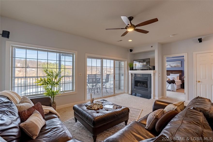 This beautiful walk-in unit is located in a well-known gated condominium complex. Upon entry, you’ll be impressed by the open floor plan and stunning lake views, showcased from the great room with gas fireplace and the oversized screened concrete deck—providing an additional living and entertaining space. Fully furnished with accessories included, this condo is ready for immediate enjoyment. The kitchen features beautiful cabinetry and ample space for entertaining, complemented by a spacious dining area. The lakeside primary bedroom offers direct deck access and an inviting private bath with double vanity, jetted tub, walk-in shower, and walk-in closet. Two additional bedrooms share a full guest bath. The oversized laundry room includes a washer, dryer, and extra storage. This unit includes a boat slip in a deep-water, DblePWC drive on lifts in slip, protected cove and offers elevator access for an easy walk to the dock or the community pool and hot tub, both featuring lake views. The convenient location by land and water places you just minutes from area amenities. The complex also offers a playground, ample parking, making it ideal for full-time, part-time use, or hosting guests.